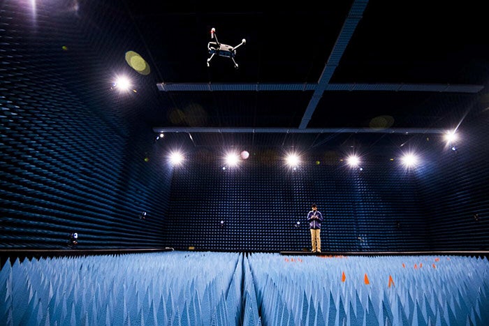 An engineering graduate student flies a drone in the Unmanned Aircraft Systems (UAS) facility at the George J. Kostas Research Institute for Homeland Security in Burlington, Massachusetts. Photo by Adam Glanzman/Northeastern University.